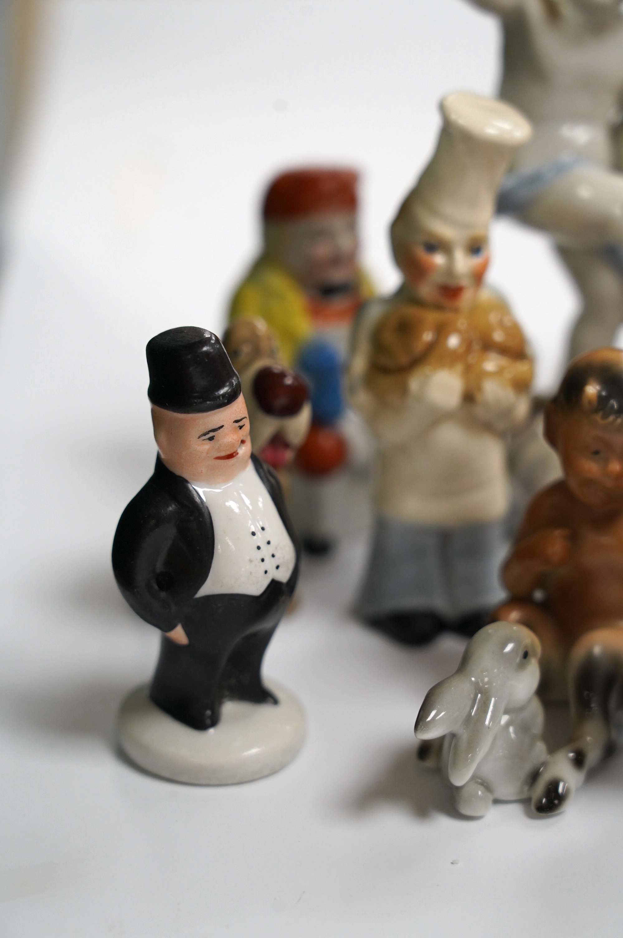 A box of small figures including Wade ceramics, Metzler & Ortloff, etc. highest 12.5cm (14). Condition - fair to good